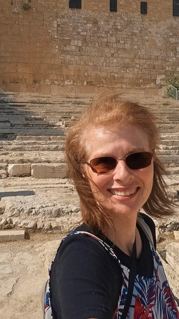 Margaret among ancient stone steps in Jerusalem