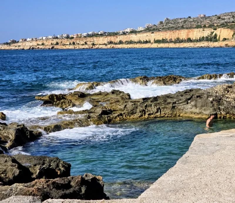 A sheltered swimming cove surrounded by rock